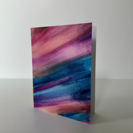 Greeting card with abstract purple and blue design on a white background